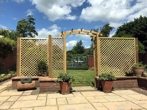 Decorative archway and trellis in Thame garden